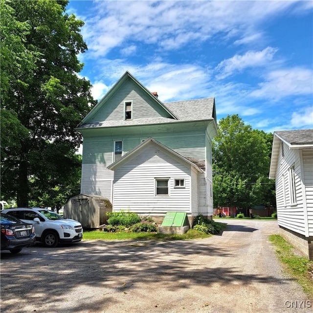47 Miner Ave, Camden, NY 13316 - view of side of property featuring a storage shed and a shingled roof