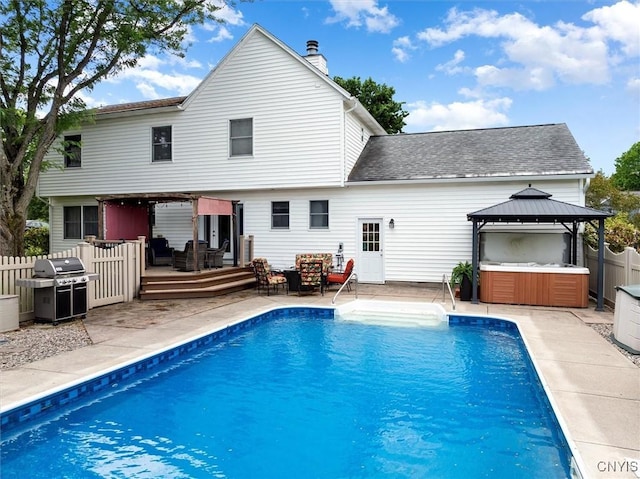 109 Hunt Valley Rd, Oneida-Inside, NY 13421 - rear view of house with a hot tub, a deck, a gazebo, a chimney, and an outdoor living space