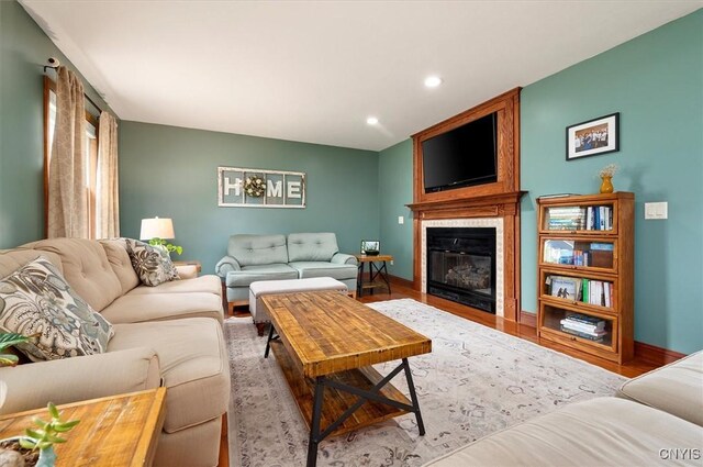 109 Hunt Valley Rd, Oneida-Inside, NY 13421 - living room with recessed lighting, a large fireplace, and wood finished floors
