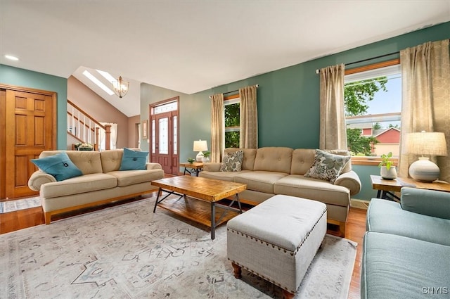 109 Hunt Valley Rd, Oneida-Inside, NY 13421 - living area featuring plenty of natural light, wood finished floors, stairs, vaulted ceiling, and recessed lighting