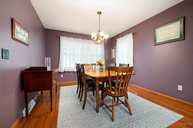 109 Hunt Valley Rd, Oneida-Inside, NY 13421 - dining area with a chandelier and wood finished floors