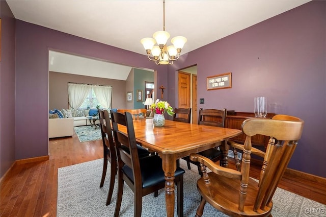 109 Hunt Valley Rd, Oneida-Inside, NY 13421 - dining area featuring a chandelier and wood finished floors
