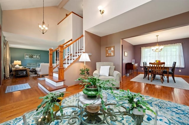 109 Hunt Valley Rd, Oneida-Inside, NY 13421 - living room with a chandelier, wood-type flooring, stairway, beamed ceiling, and high vaulted ceiling