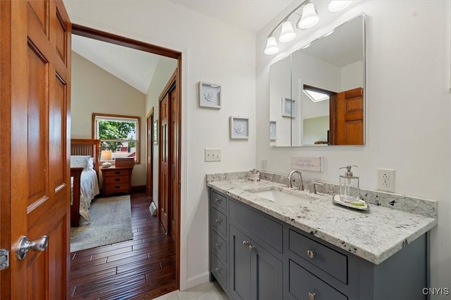 109 Hunt Valley Rd, Oneida-Inside, NY 13421 - bathroom featuring vanity, lofted ceiling, wood finished floors, and ensuite bathroom