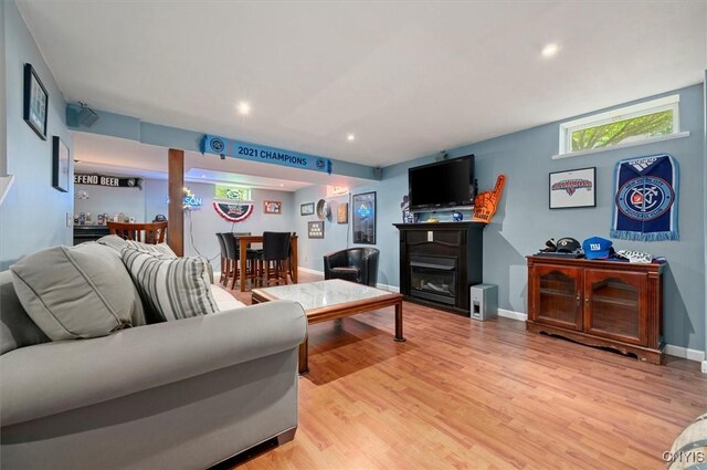 109 Hunt Valley Rd, Oneida-Inside, NY 13421 - living room featuring light wood-style flooring, a glass covered fireplace, and recessed lighting