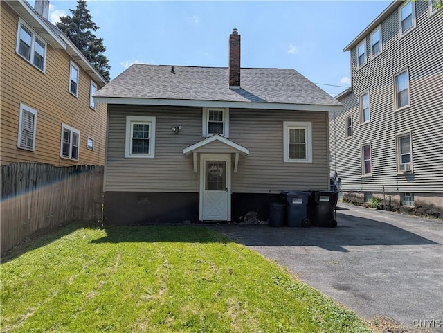 305 S Midler Ave, Syracuse, NY 13206 - back of property featuring a chimney, a shingled roof, and cooling unit
