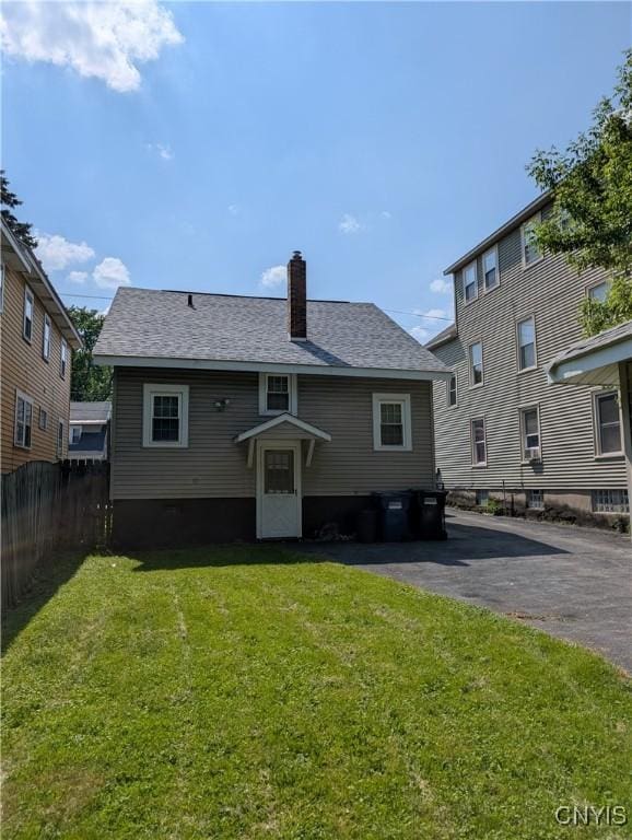 305 S Midler Ave, Syracuse, NY 13206 - back of house with a chimney and roof with shingles