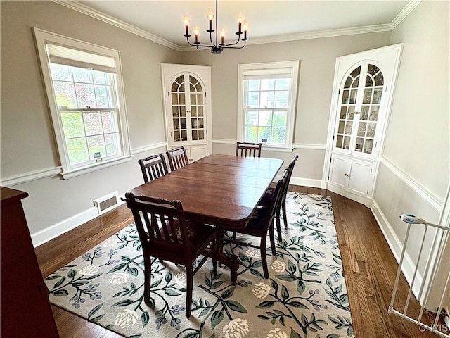 308 Haddonfield Dr, Dewitt, NY 13214 - dining area featuring a chandelier, dark wood finished floors, and ornamental molding
