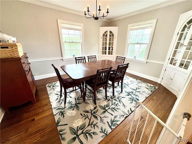 308 Haddonfield Dr, Dewitt, NY 13214 - dining area with healthy amount of natural light, dark wood finished floors, a chandelier, and crown molding