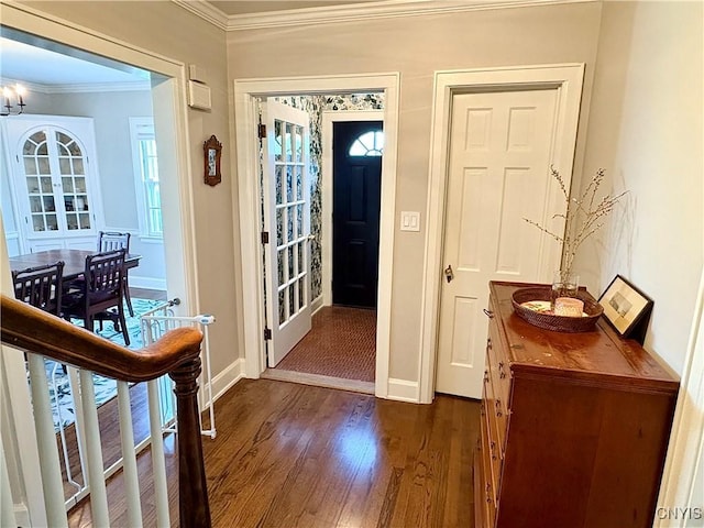 308 Haddonfield Dr, Dewitt, NY 13214 - foyer entrance with dark wood-style flooring, crown molding, and a chandelier