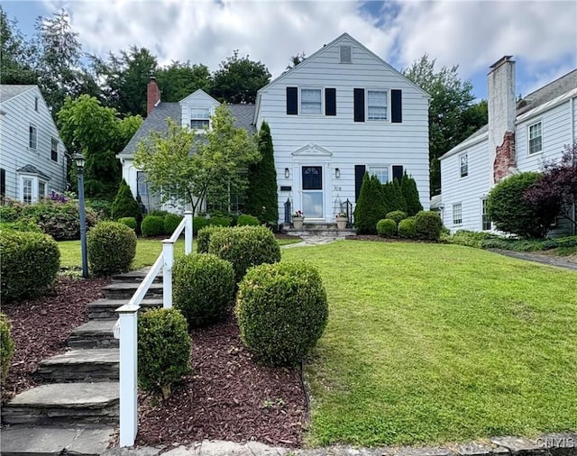308 Haddonfield Dr, Dewitt, NY 13214 - traditional-style home featuring a front yard and a chimney
