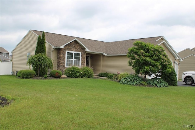 4745 Lynnville, Clay, NY 13041 - view of front facade featuring stone siding, a front lawn, and roof with shingles