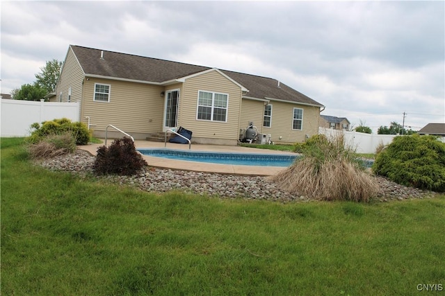 4745 Lynnville, Clay, NY 13041 - rear view of house with a patio and a shingled roof