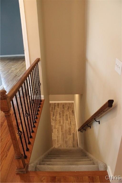 4745 Lynnville, Clay, NY 13041 - stairway featuring baseboards and wood finished floors