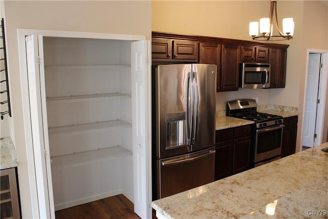 4745 Lynnville, Clay, NY 13041 - kitchen with appliances with stainless steel finishes, a chandelier, light stone countertops, dark wood-style flooring, and dark brown cabinets