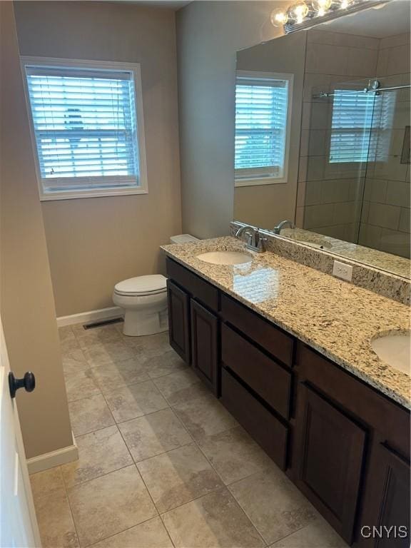 4745 Lynnville, Clay, NY 13041 - bathroom featuring double vanity, healthy amount of natural light, and a stall shower