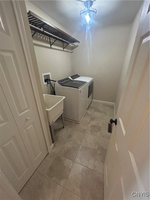4745 Lynnville, Clay, NY 13041 - washroom with washer and clothes dryer and light tile patterned floors