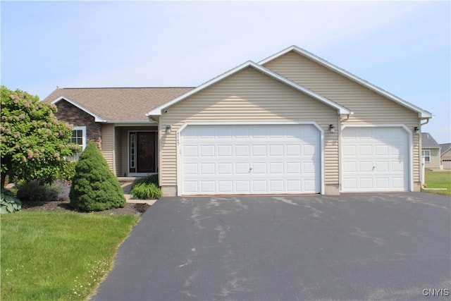 4745 Lynnville, Clay, NY 13041 - ranch-style house featuring asphalt driveway and an attached garage
