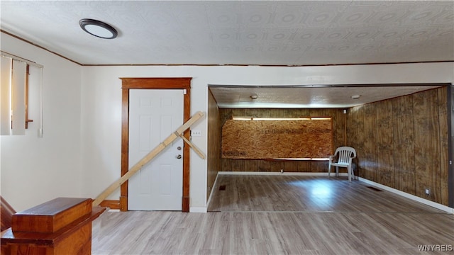 133 Freund St, Buffalo, NY 14215 - unfurnished living room featuring wood finished floors and wood walls