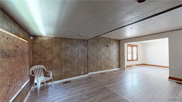 133 Freund St, Buffalo, NY 14215 - spare room with wood finished floors and wood walls