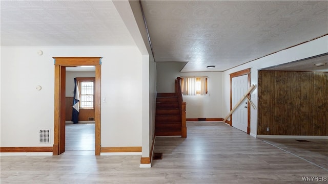 133 Freund St, Buffalo, NY 14215 - spare room with an ornate ceiling, wood finished floors, and stairs