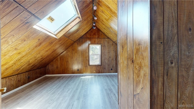 133 Freund St, Buffalo, NY 14215 - bonus room featuring vaulted ceiling, wooden walls, a skylight, and wood finished floors