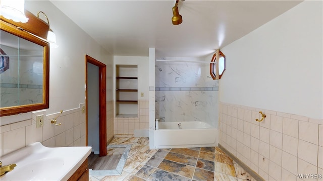 133 Freund St, Buffalo, NY 14215 - full bath with tile walls, vanity, shower / bathtub combination, and a wainscoted wall
