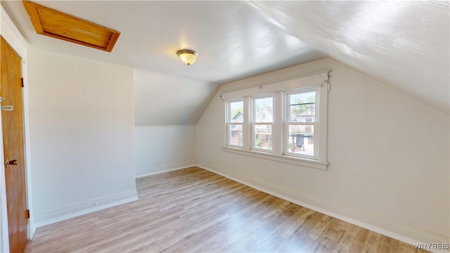 133 Freund St, Buffalo, NY 14215 - additional living space with attic access, wood finished floors, and vaulted ceiling