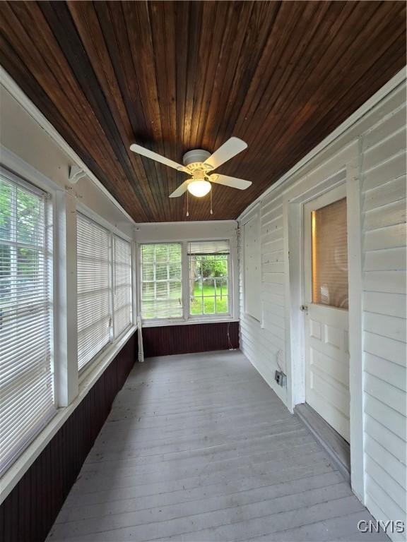 259 Flower Ave W, Watertown-City, NY 13601 - unfurnished sunroom with ceiling fan and plenty of natural light