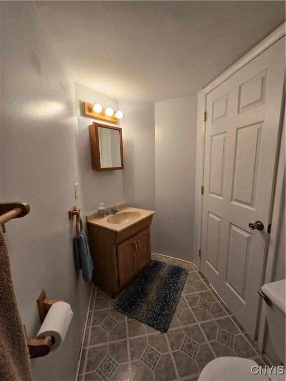 259 Flower Ave W, Watertown-City, NY 13601 - bathroom with vanity and tile patterned floors