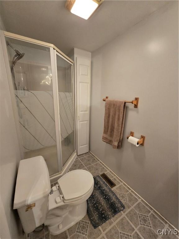 259 Flower Ave W, Watertown-City, NY 13601 - full bath with a shower stall and tile patterned flooring