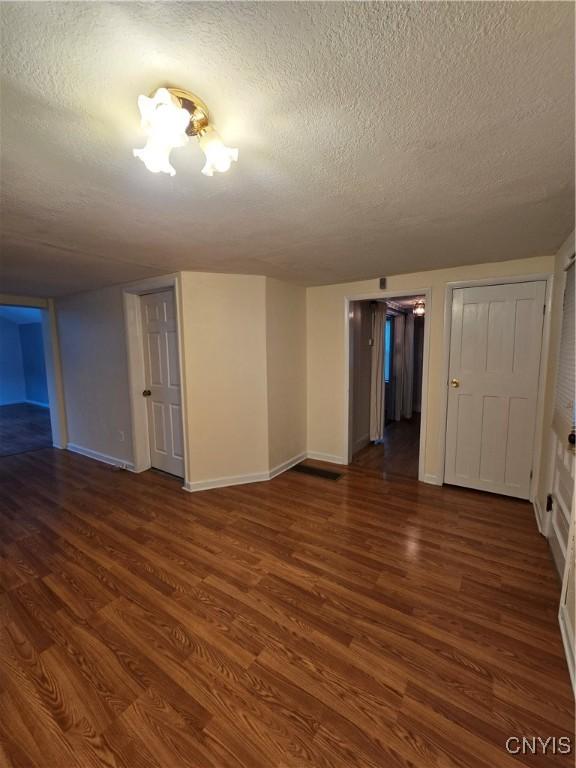 259 Flower Ave W, Watertown-City, NY 13601 - unfurnished room featuring a textured ceiling and wood finished floors