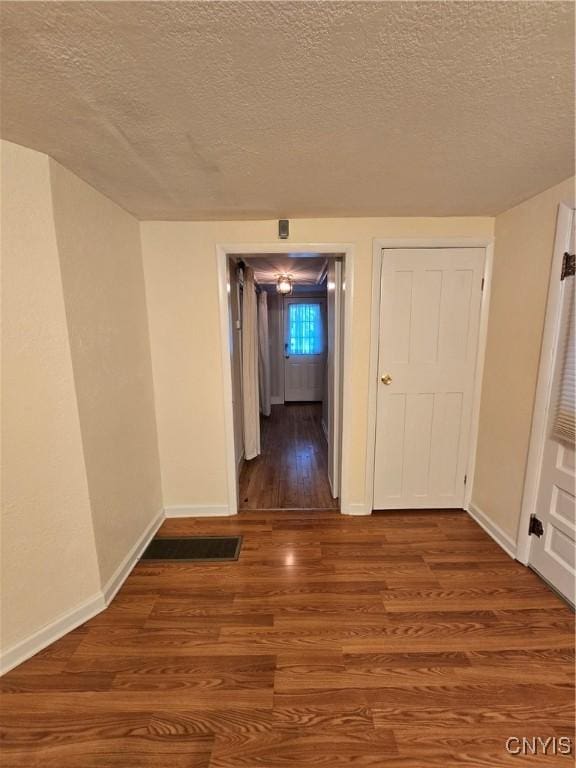 259 Flower Ave W, Watertown-City, NY 13601 - hall featuring wood finished floors and a textured ceiling
