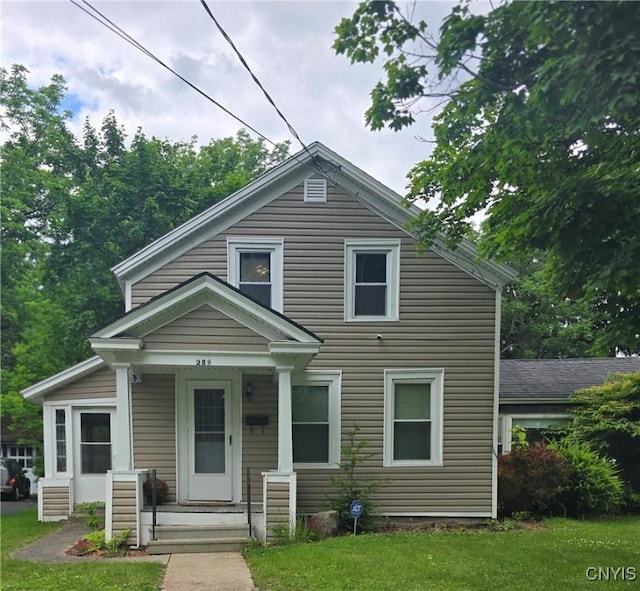 259 Flower Ave W, Watertown-City, NY 13601 - view of front facade with covered porch and a front lawn