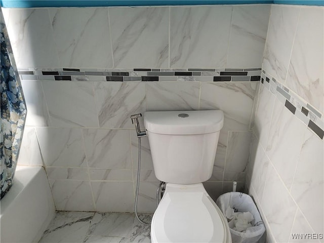 196 Kilhoffer St Unit B, Buffalo, NY 14211 - bathroom featuring shower / bathtub combination with curtain, tile walls, and marble finish flooring
