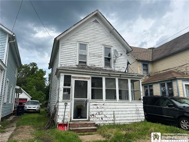 1014 N Union St, Olean-City, NY 14760 - view of front of house with entry steps and a sunroom