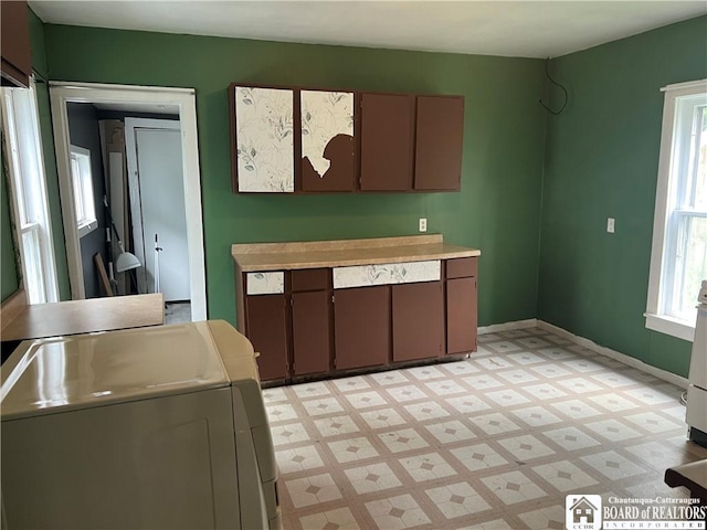1014 N Union St, Olean-City, NY 14760 - kitchen featuring washer and clothes dryer, light floors, and light countertops