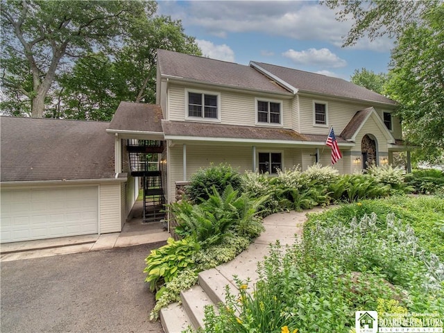 5 Summit Park Dr, Ellery, NY 14712 - view of front of home with stairs, an attached garage, and asphalt driveway