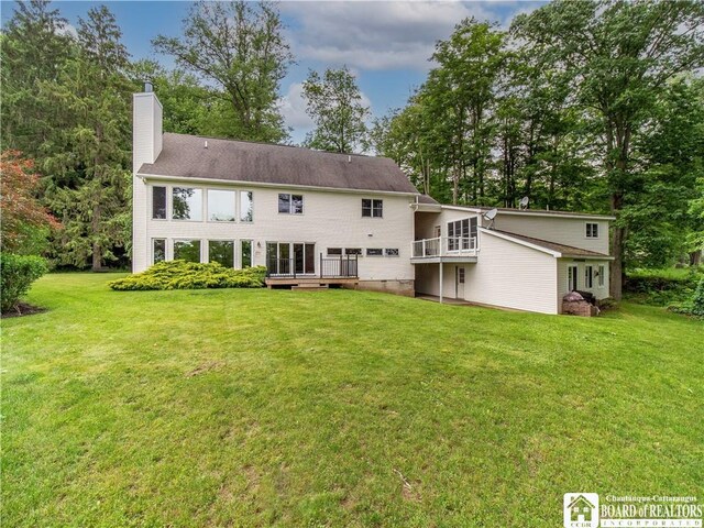 5 Summit Park Dr, Ellery, NY 14712 - back of house featuring a chimney, a yard, a wooden deck, and view of wooded area