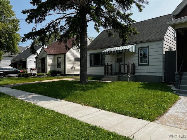 401 Ideal St, Buffalo, NY 14206 - bungalow-style house featuring a front yard and roof with shingles