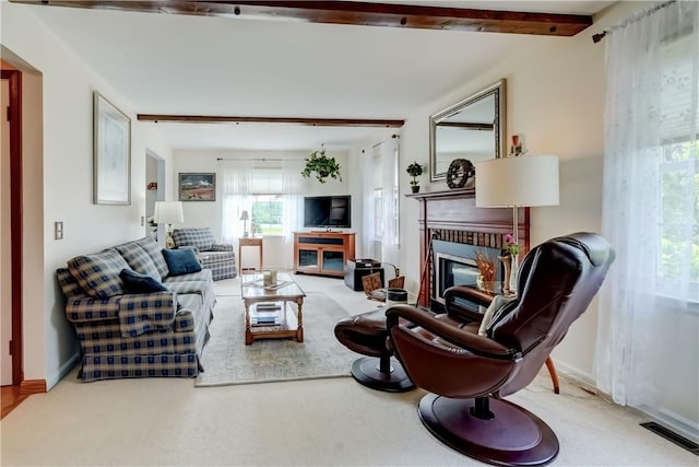 921 Wayneport Rd, Macedon, NY 14502 - living area with a glass covered fireplace and beam ceiling