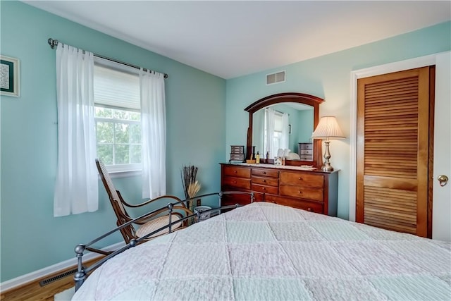 921 Wayneport Rd, Macedon, NY 14502 - bedroom featuring a closet and wood finished floors