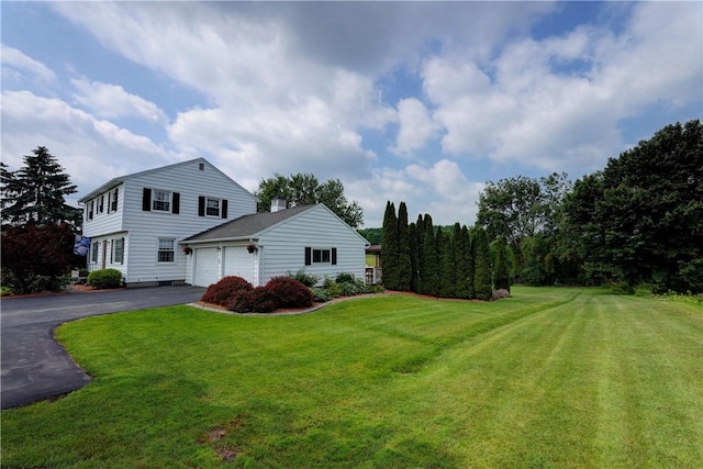 921 Wayneport Rd, Macedon, NY 14502 - view of side of property featuring an attached garage, driveway, and a yard