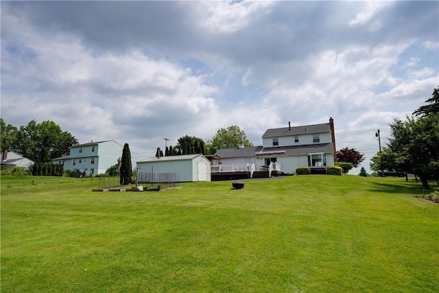 921 Wayneport Rd, Macedon, NY 14502 - view of grassy yard featuring a shed and a wooden deck