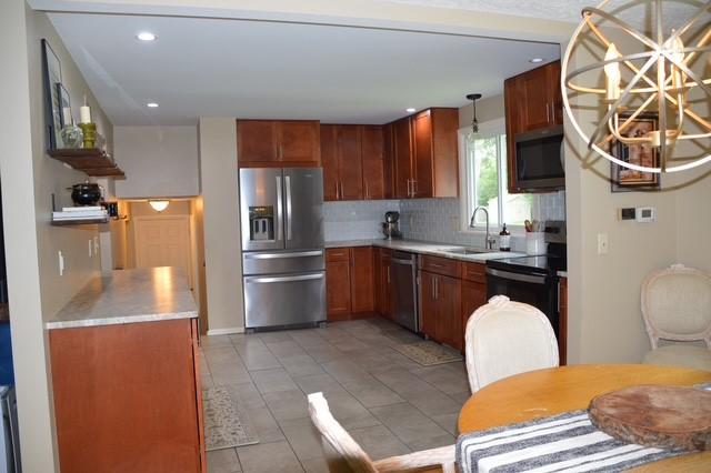 57 Timberline Dr, Penfield, NY 14526 - kitchen with appliances with stainless steel finishes, decorative backsplash, light countertops, recessed lighting, and hanging light fixtures