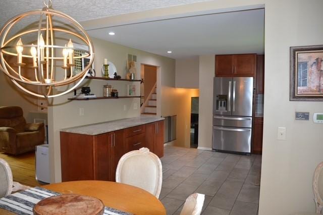 57 Timberline Dr, Penfield, NY 14526 - kitchen featuring stainless steel fridge with ice dispenser, a chandelier, recessed lighting, and light tile patterned floors