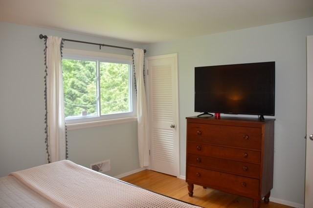 57 Timberline Dr, Penfield, NY 14526 - bedroom with light wood-style flooring and baseboards