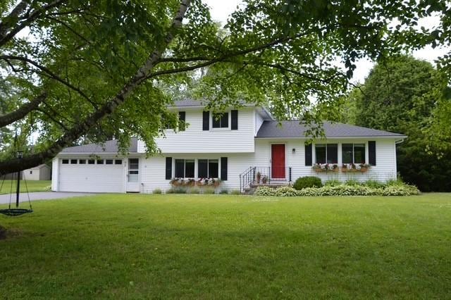 57 Timberline Dr, Penfield, NY 14526 - split level home featuring a front yard, driveway, and an attached garage