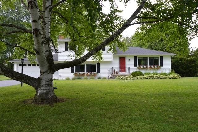57 Timberline Dr, Penfield, NY 14526 - split level home featuring a front lawn
