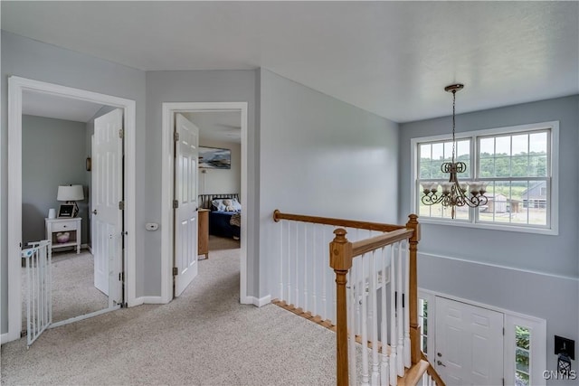 33039 County Route 22, Antwerp, NY 13691 - hallway with a chandelier, carpet, and an upstairs landing